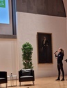 A woman is giving a speech