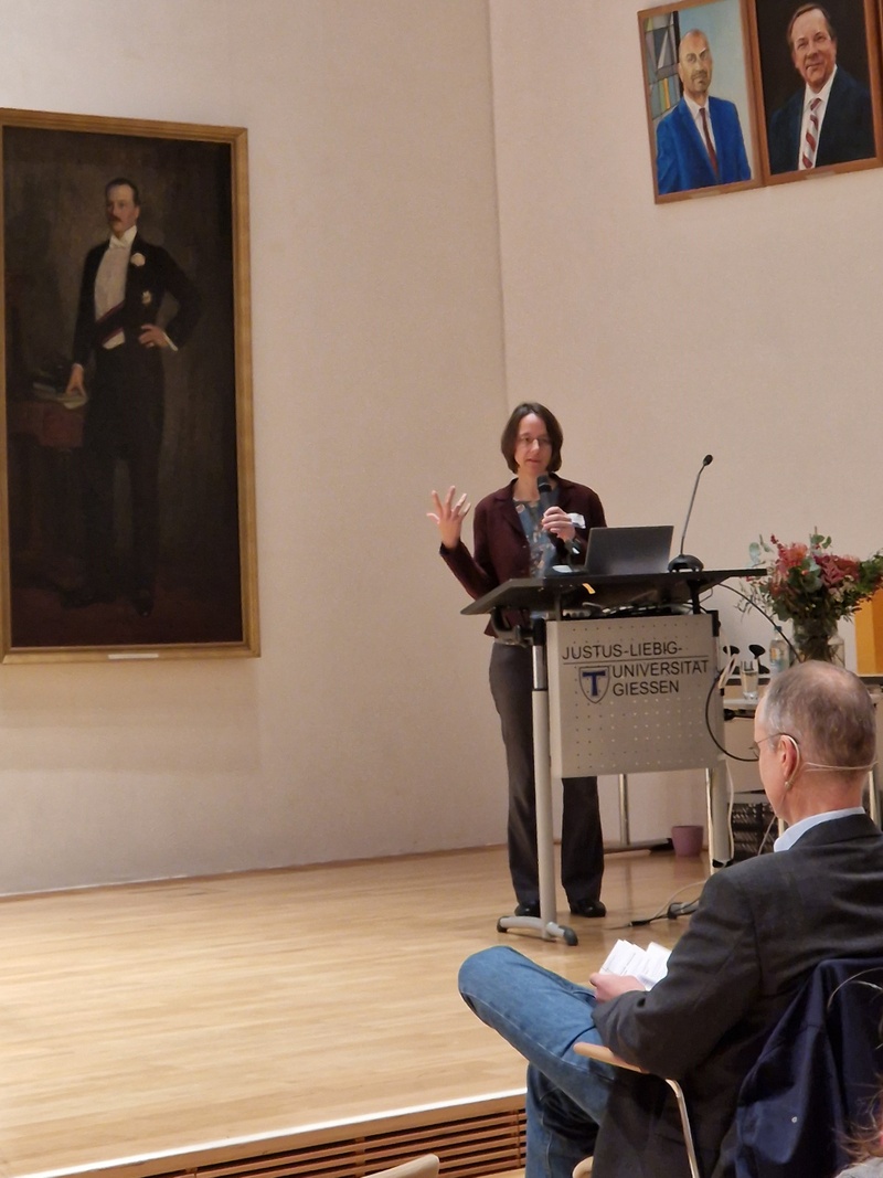 A woman is giving a speech3