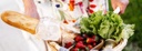 Basket of baguette and fruits