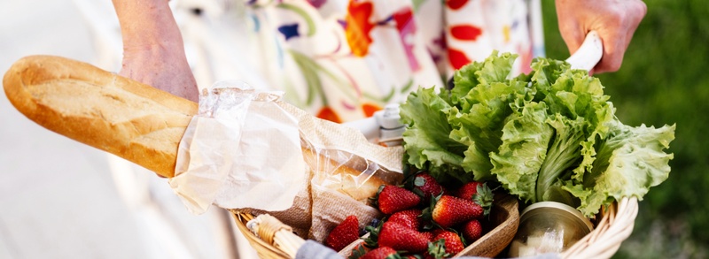 Basket of baguette and fruits