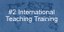 Banner mit der Aufschrift '#2 International Teaching Training' in weißer Schrift auf einem blauen Overlay. Darunter sieht man deine Weltkarte. Dieses Bild dient als Hyperlink zur Unterseite der Maßnahme #2 International Teaching Training.