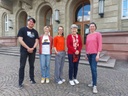 Foto von vier Mitarbeiter_Innen
