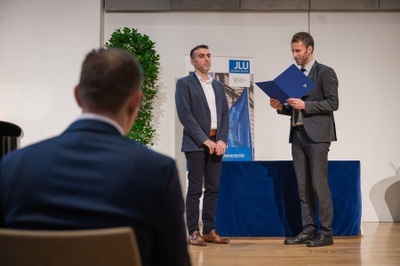Vice president Kruger congratulates Mr. Azimi