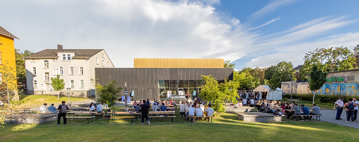 Botanical Garden This image links to the "campus" section and shows a celebration outside the theatre laboratory
