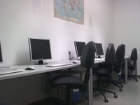Several desks with computers