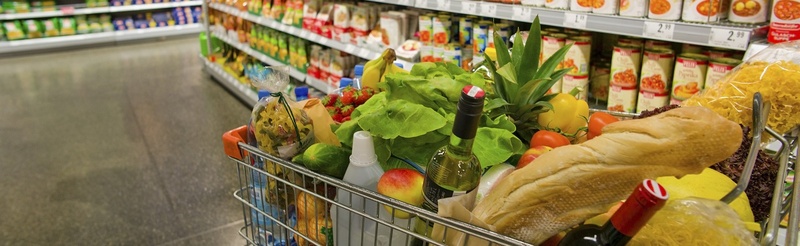 full shopping cart in supermarket